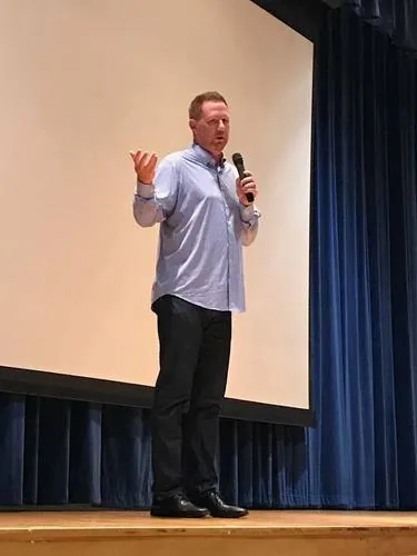 Pat Yates presenting to a full auditorium